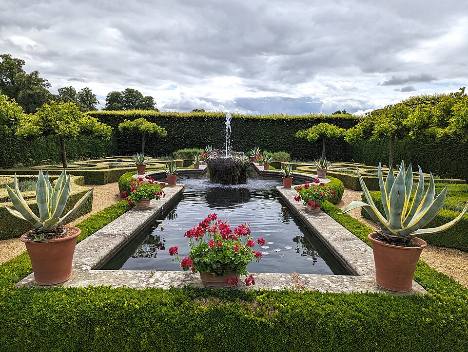 Raised formal pond showing constructed walls and coping.